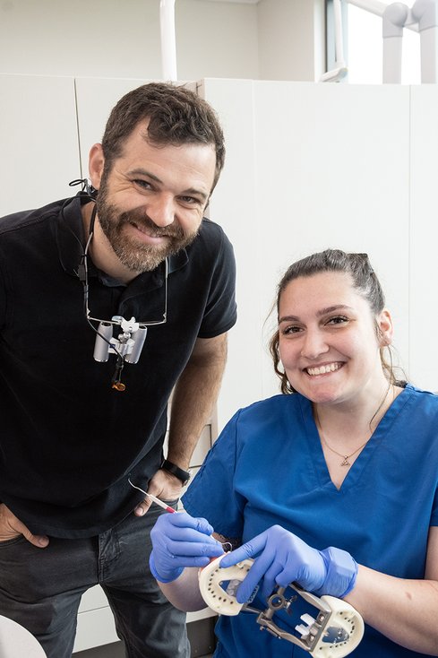 dental assisting student with instructor