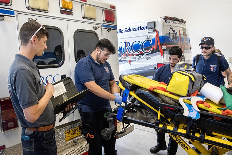 ems students with instructor and ambulance
