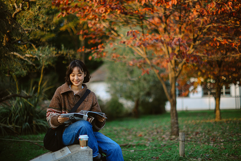 Student studying fall colors