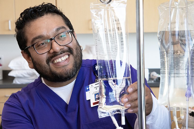 pratical nursing student with an IV