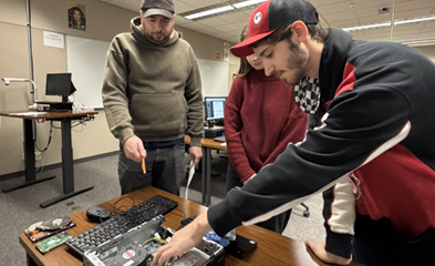 STEM students working on computer hardware